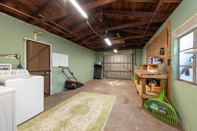 garage with independent washer and dryer and wood ceiling