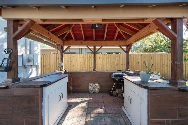 view of patio / terrace with a gazebo and an outdoor kitchen