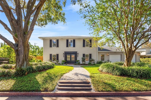 view of front of home with french doors and a garage