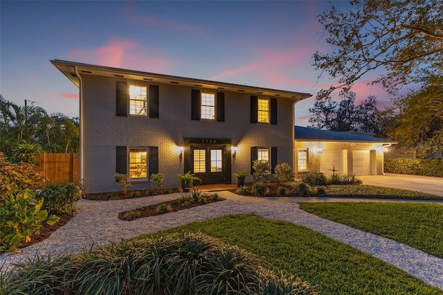 view of front of house with french doors and a garage