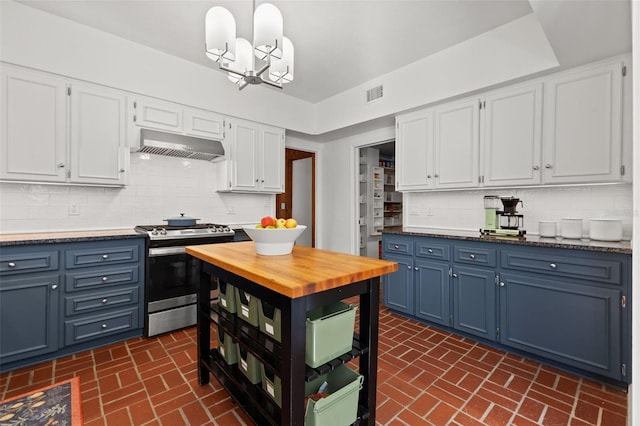 kitchen with blue cabinets, stainless steel range, tasteful backsplash, a notable chandelier, and white cabinetry