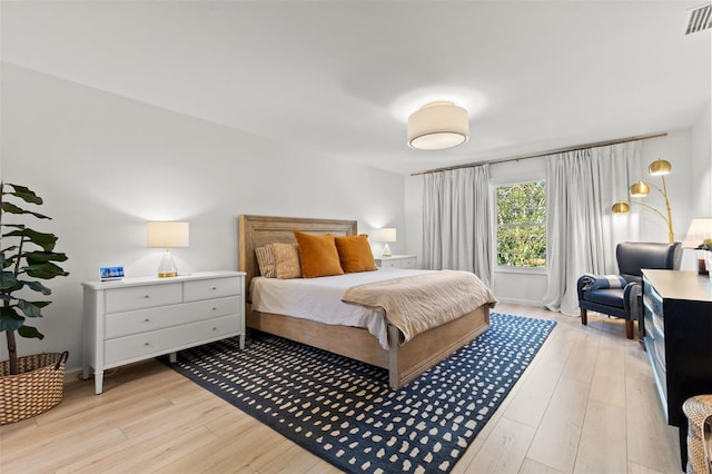 bedroom with light wood-type flooring