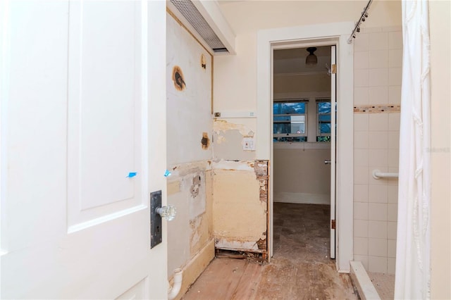 full bathroom with tiled shower