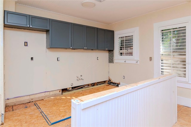 kitchen featuring light countertops and ornamental molding