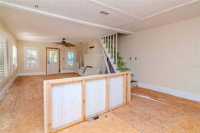 kitchen with visible vents, ceiling fan, and baseboards