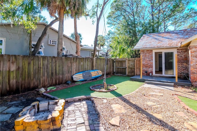 view of yard featuring french doors and fence