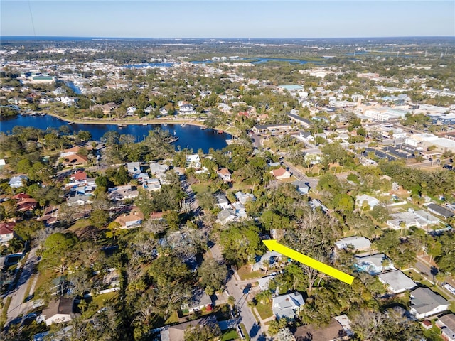 birds eye view of property with a residential view and a water view