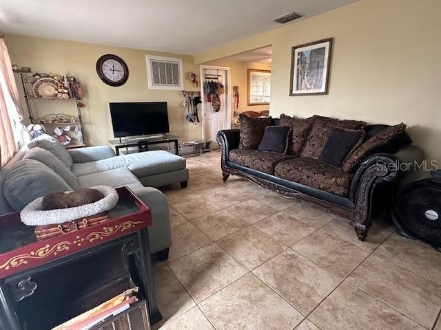 living room with tile patterned flooring