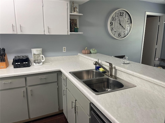 kitchen with gray cabinetry, white cabinetry, sink, dishwasher, and dark hardwood / wood-style floors