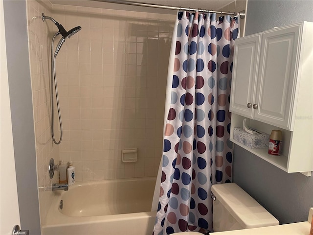 bathroom with shower / bath combo with shower curtain and toilet