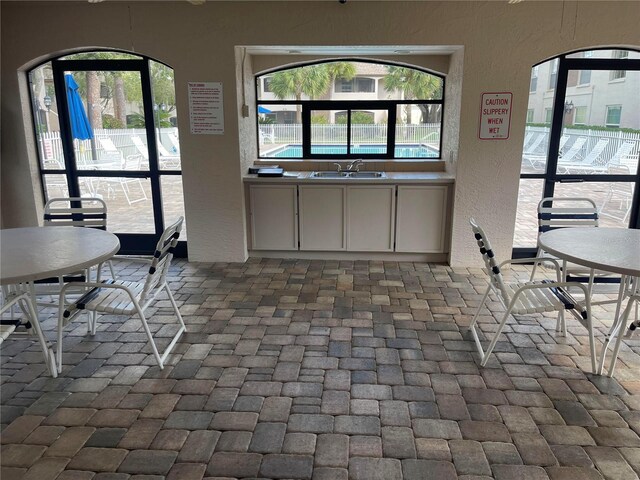 unfurnished dining area with sink