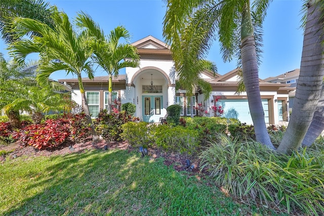 view of front of house with french doors and a garage