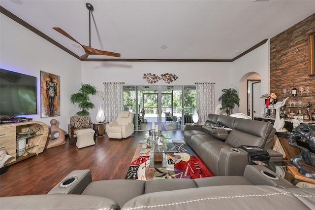 living room with dark hardwood / wood-style floors, ceiling fan, and crown molding