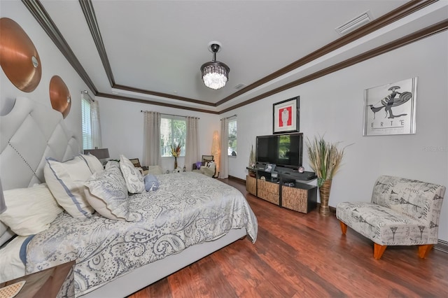 bedroom with ornamental molding and dark wood-type flooring