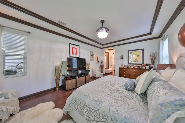 bedroom with dark hardwood / wood-style flooring and crown molding