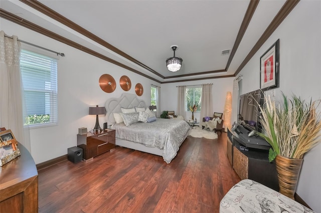 bedroom featuring dark hardwood / wood-style floors and crown molding