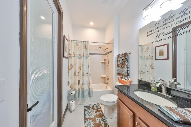 full bathroom with tile patterned flooring, shower / tub combo, vanity, and toilet