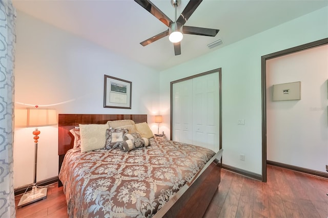 bedroom featuring ceiling fan, a closet, and wood-type flooring