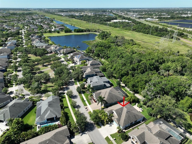 birds eye view of property featuring a water view