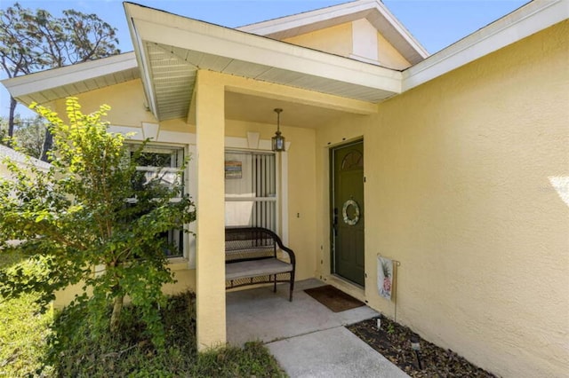 doorway to property featuring a porch