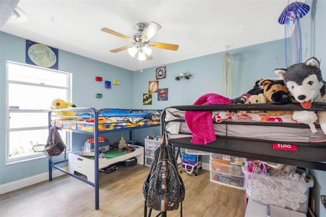 bedroom with hardwood / wood-style flooring and ceiling fan