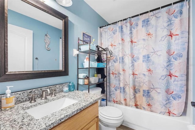 full bathroom featuring vanity, shower / bath combination with curtain, and toilet