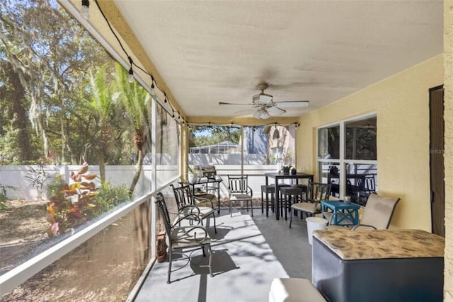 sunroom / solarium with ceiling fan