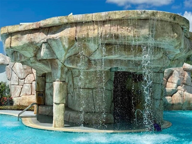 view of pool featuring pool water feature