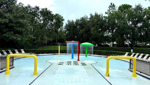 view of swimming pool featuring pool water feature