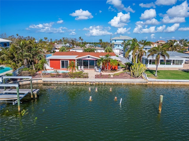 back of house with a water view