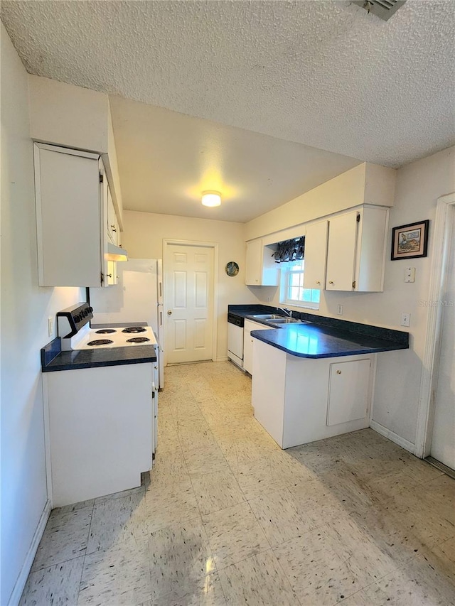 kitchen featuring a textured ceiling, white dishwasher, white cabinetry, and sink