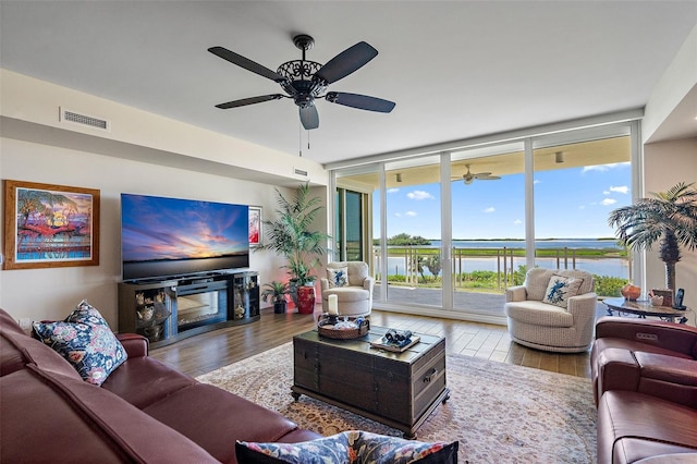 living room featuring light hardwood / wood-style flooring and expansive windows