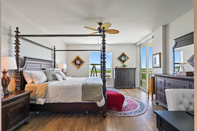 bedroom featuring hardwood / wood-style flooring, ceiling fan, and access to exterior