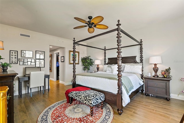 bedroom with ceiling fan and wood-type flooring