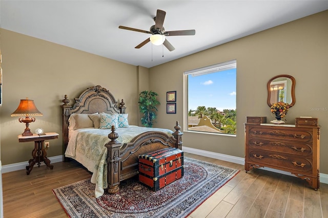 bedroom featuring ceiling fan and wood-type flooring