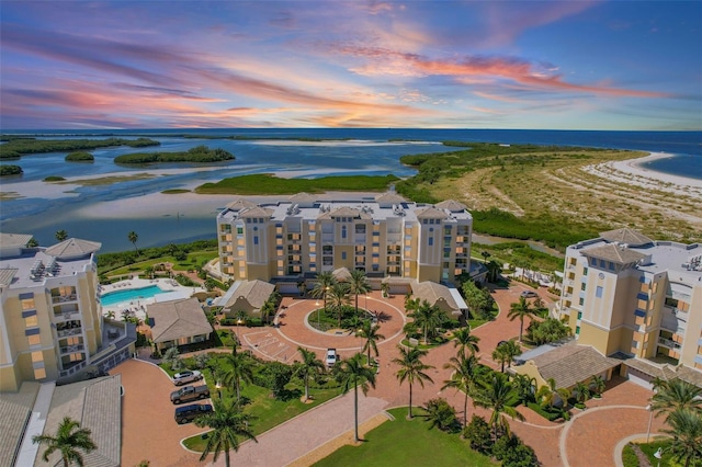 aerial view at dusk with a water view