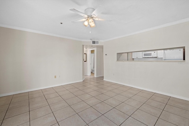 unfurnished room with ceiling fan, ornamental molding, visible vents, and baseboards