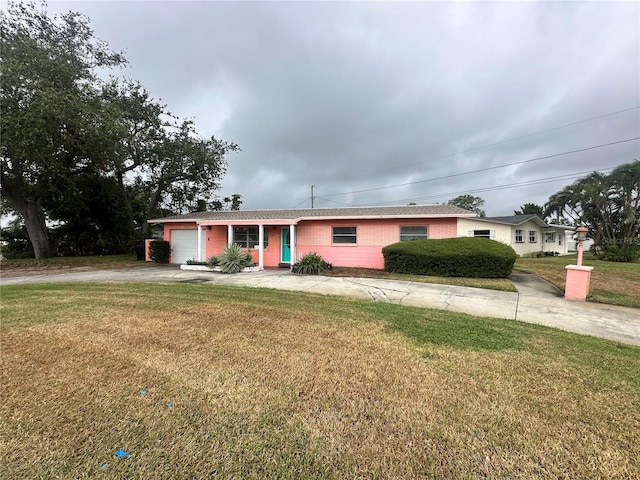 single story home with a garage and a front yard