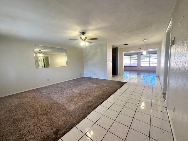 empty room with light colored carpet and ceiling fan