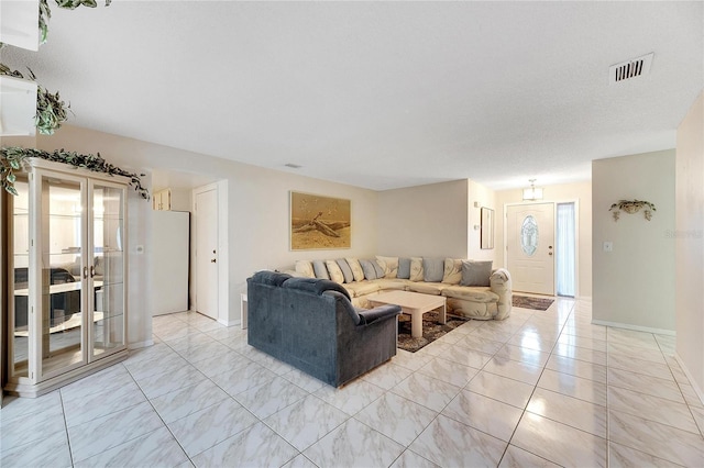 living room with a textured ceiling