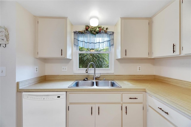 kitchen with white cabinets, dishwasher, and sink