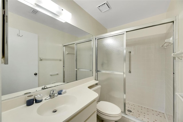 bathroom with vanity, toilet, and walk in shower