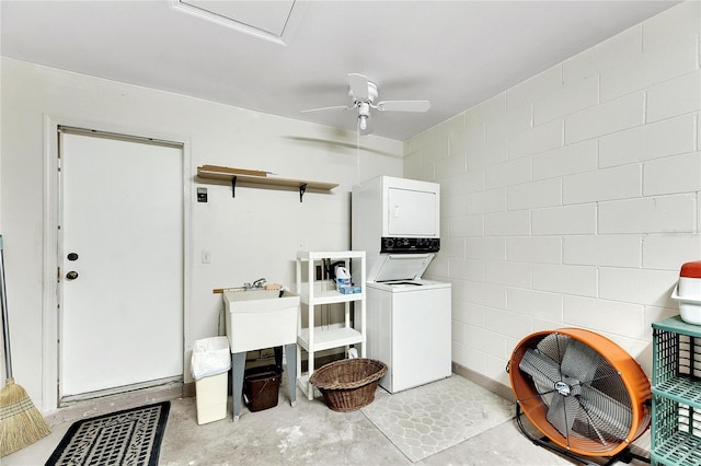 laundry area with stacked washer / dryer and ceiling fan