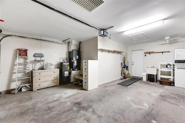 garage with a garage door opener, sink, ceiling fan, water heater, and heating unit