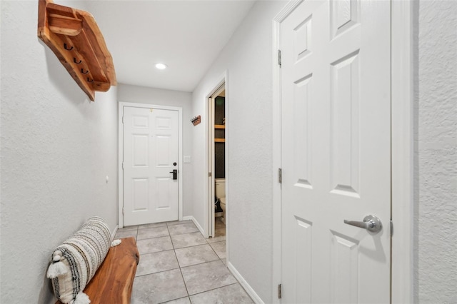 hallway with light tile patterned floors