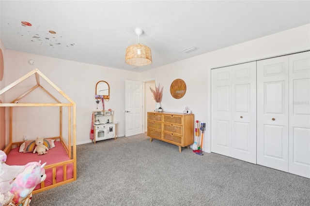 carpeted bedroom featuring a closet