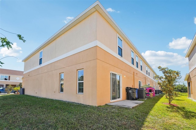 view of side of property with a yard