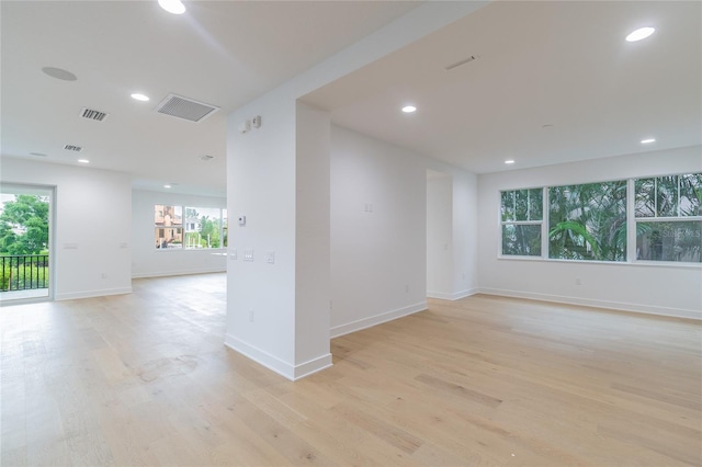 unfurnished room featuring light hardwood / wood-style floors