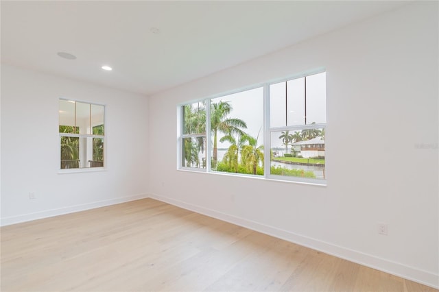 unfurnished room featuring light hardwood / wood-style floors