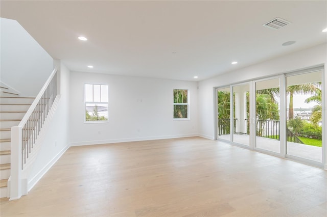 unfurnished living room featuring light hardwood / wood-style flooring